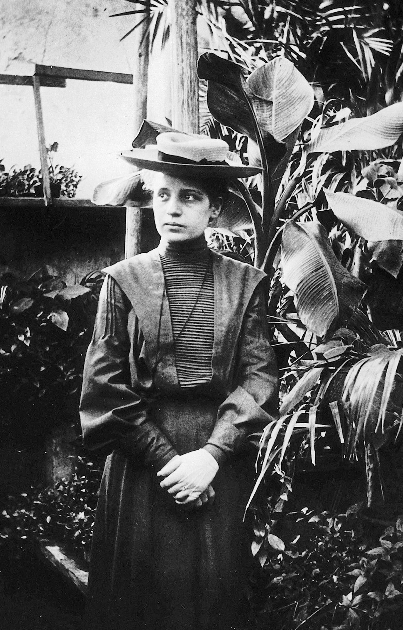 lise meitner standing by plants
