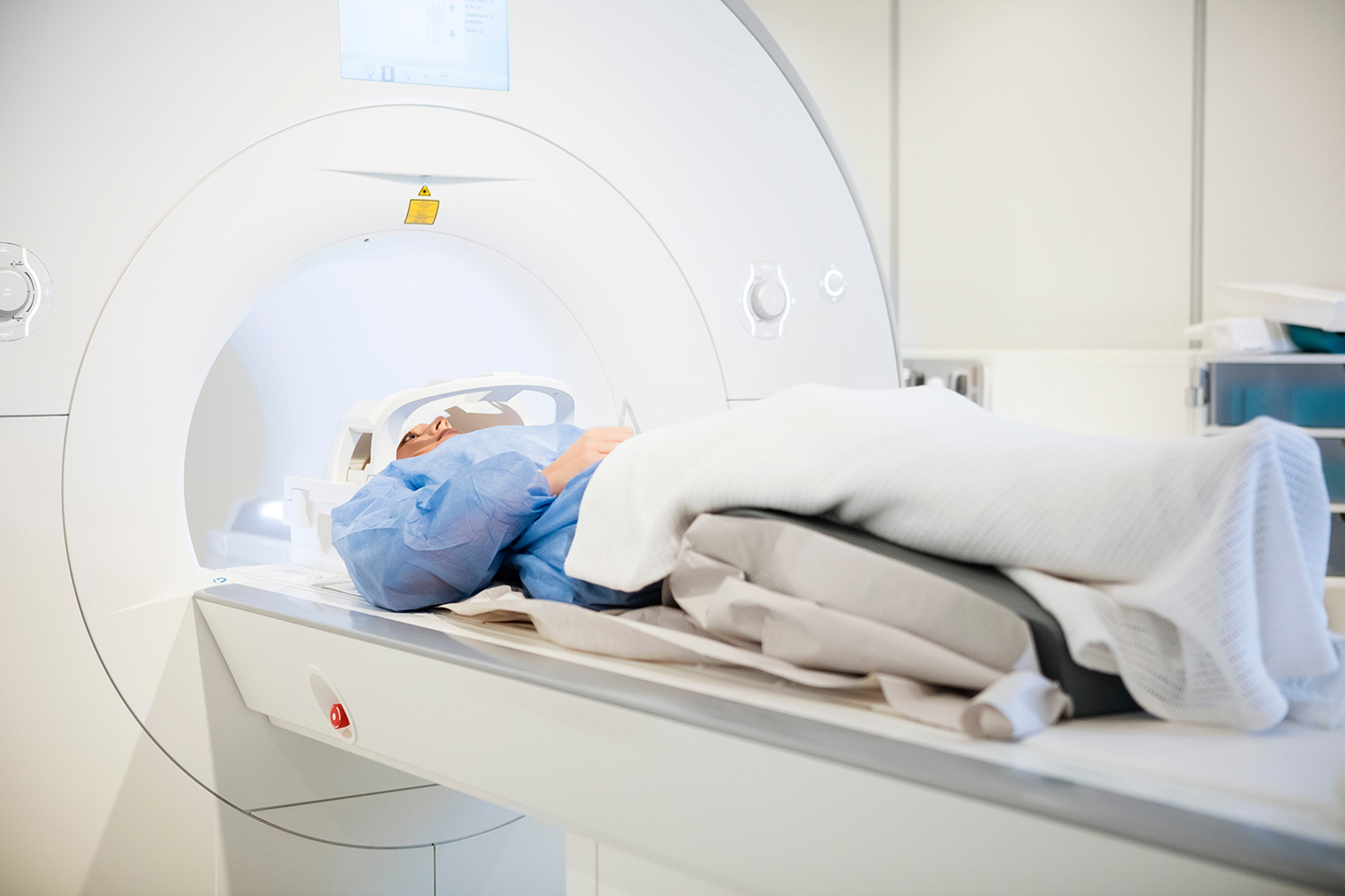 Patient Wearing Head Coil During MRI Scan In Hospital